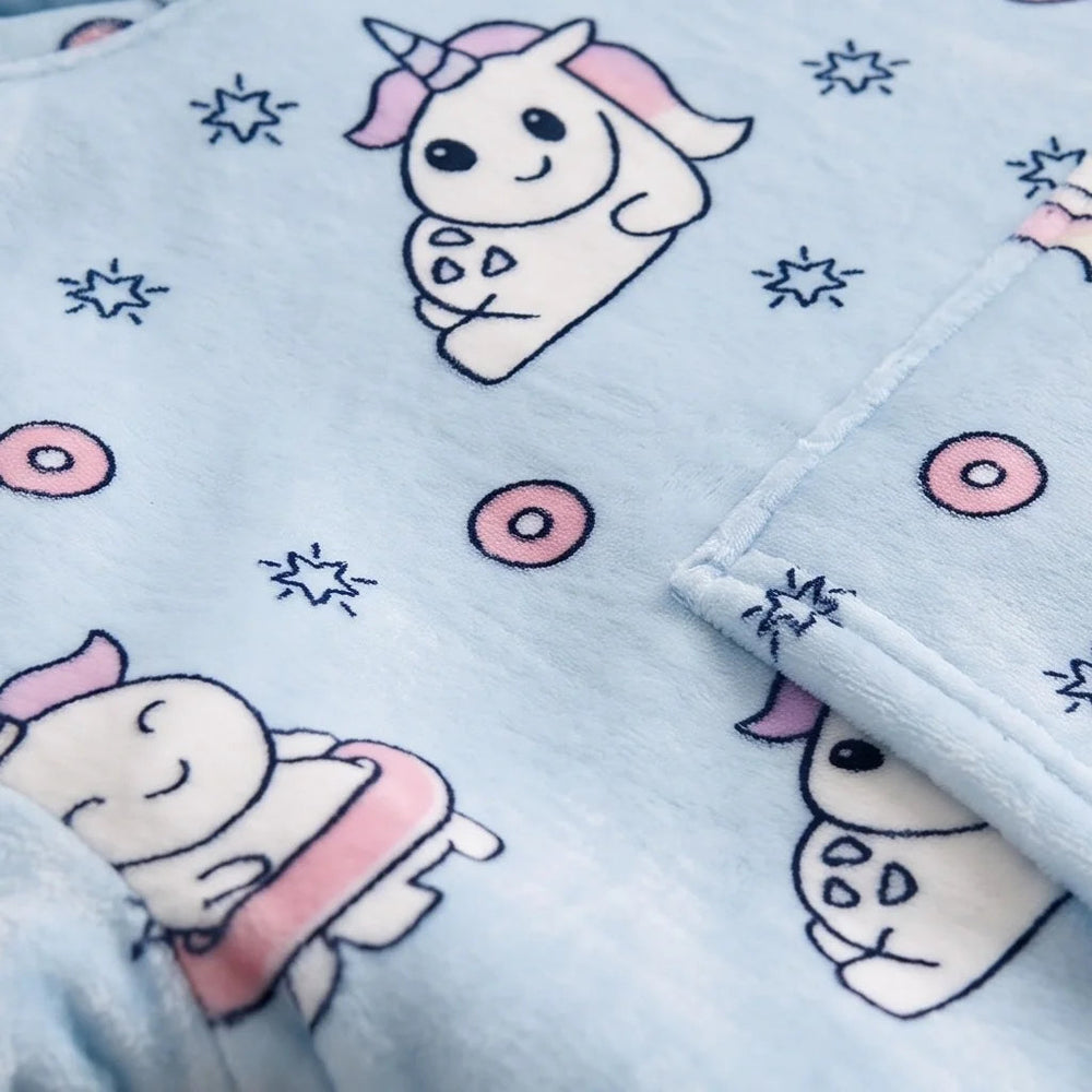 Close-up of the soft Blue Unicorn flannel and sherpa lining