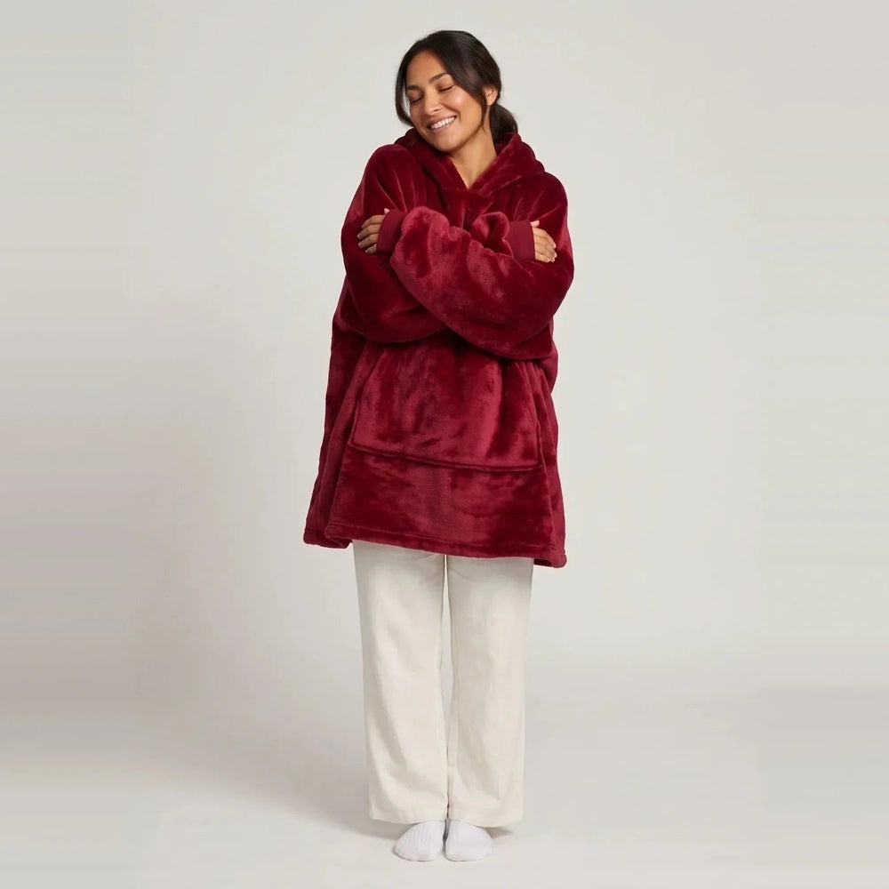 Model wearing the Burgundy blanket hoodie, oversized unisex fit, studio photo
