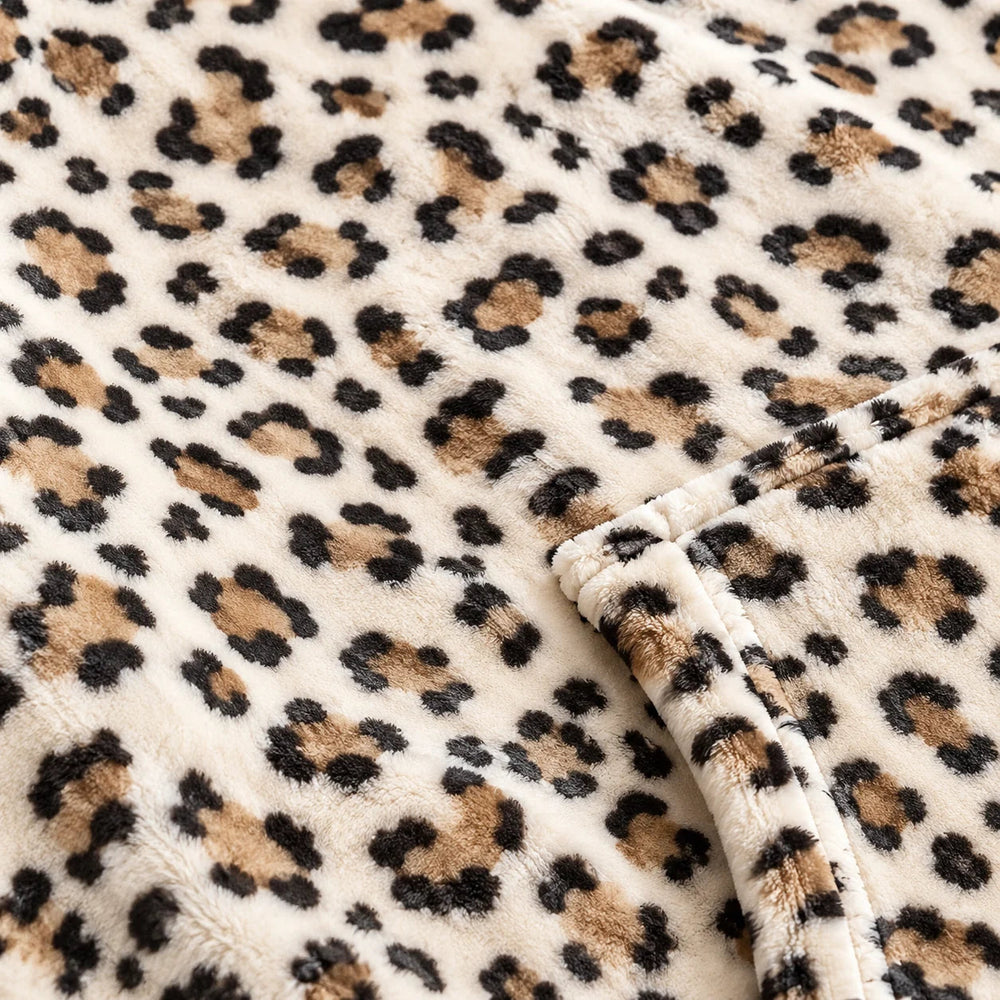 Close-up of the soft Cream Leopard flannel and sherpa lining