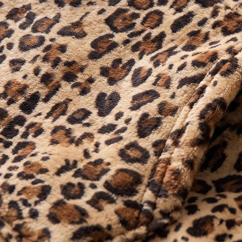 Close-up of the soft Golden Leopard flannel and sherpa lining