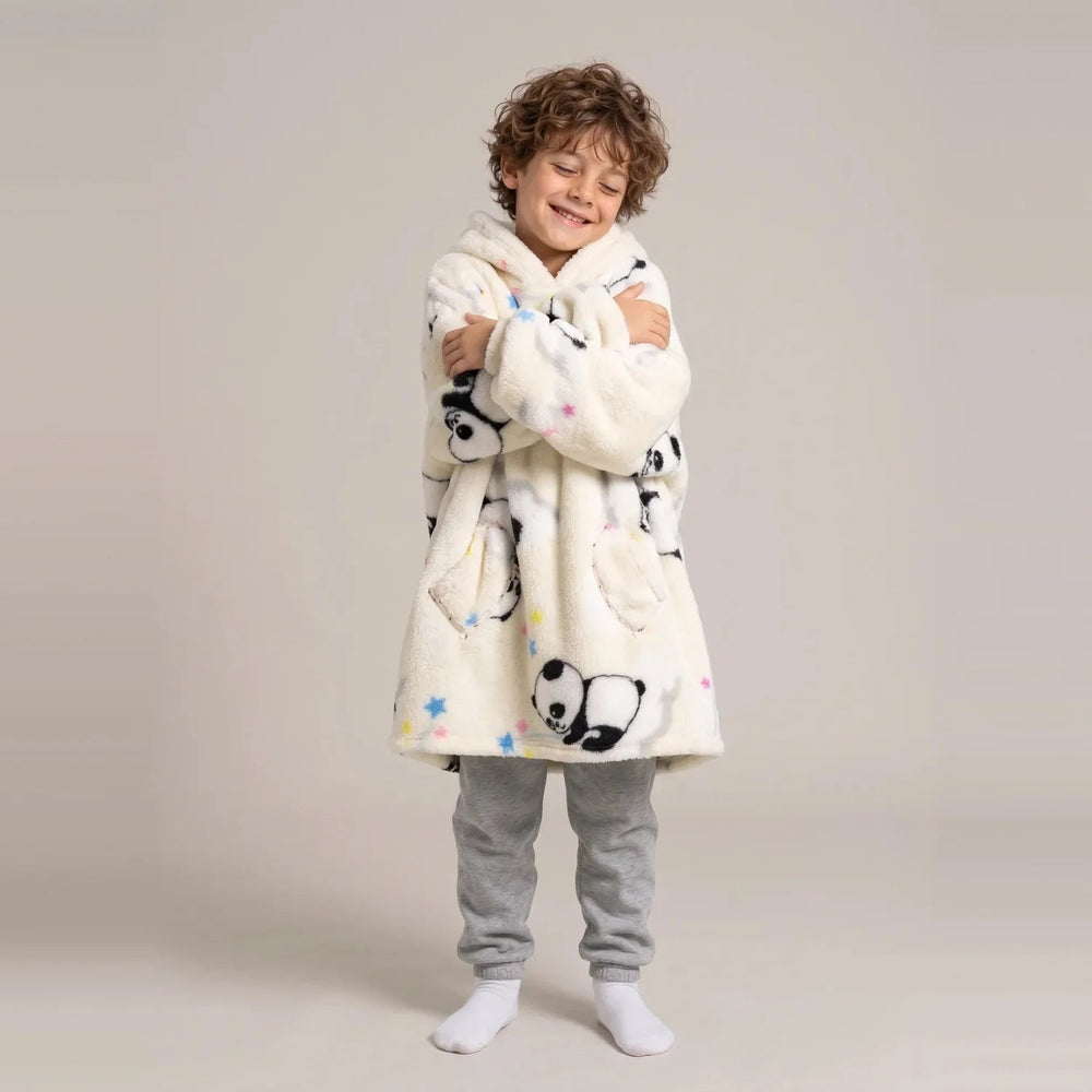 Child wearing the Cream Pandas Kids blanket hoodie, studio photo