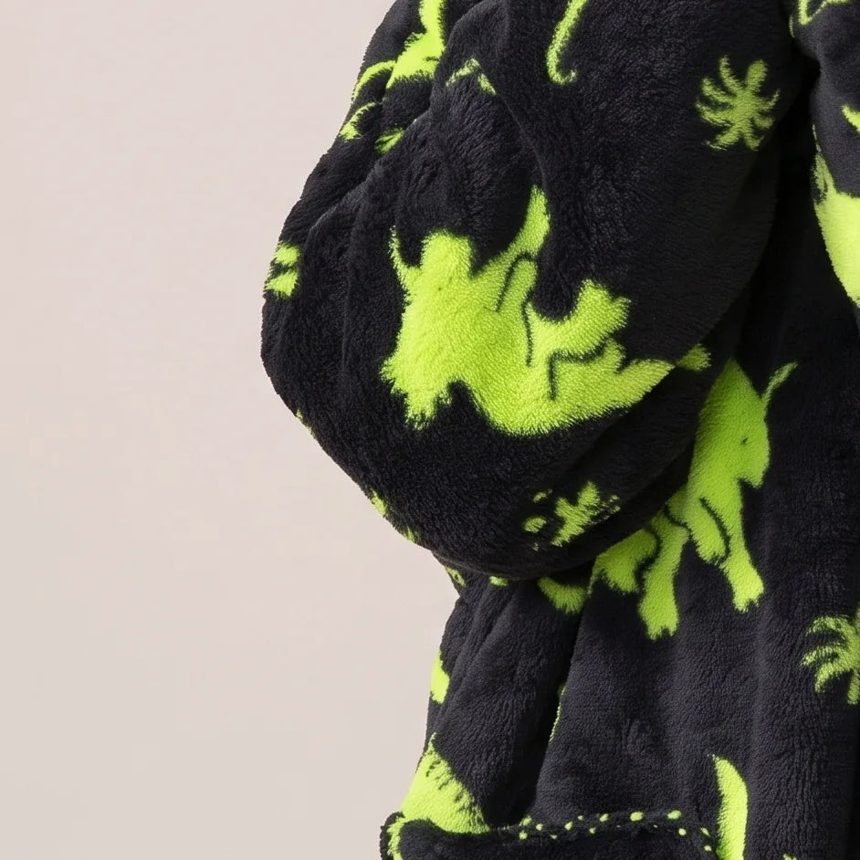 Worn detail of the Green Dinos Kids blanket hoodie: soft sleeves and pocket