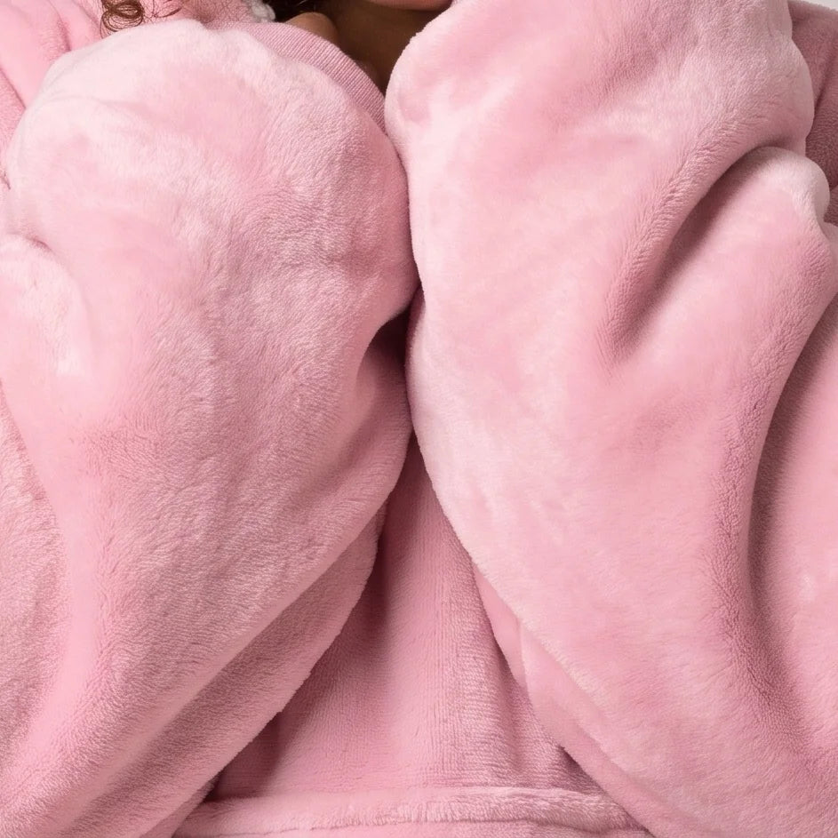 Worn detail of the Light Pink Kids blanket hoodie: soft sleeves and pocket