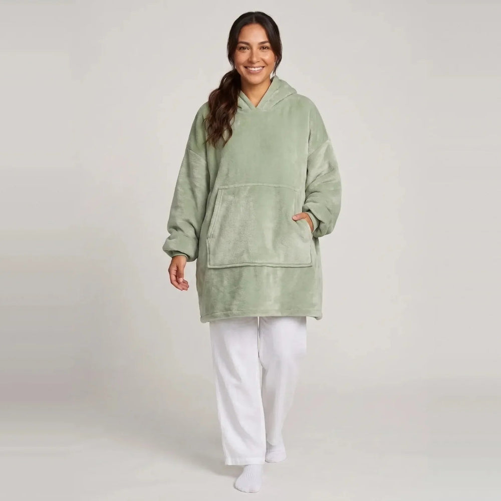 Model wearing the Matcha Green blanket hoodie, oversized unisex fit, studio photo