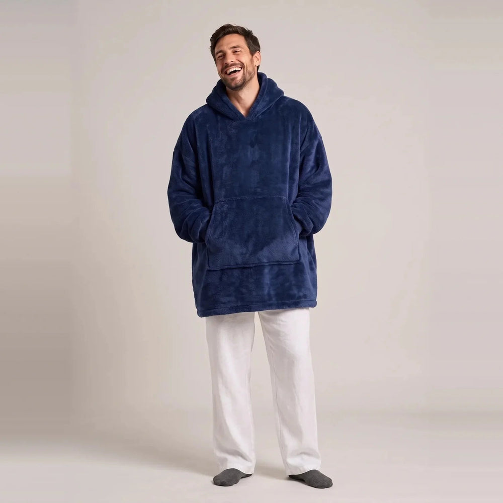Model wearing the Navy Blue blanket hoodie, oversized unisex fit, studio photo