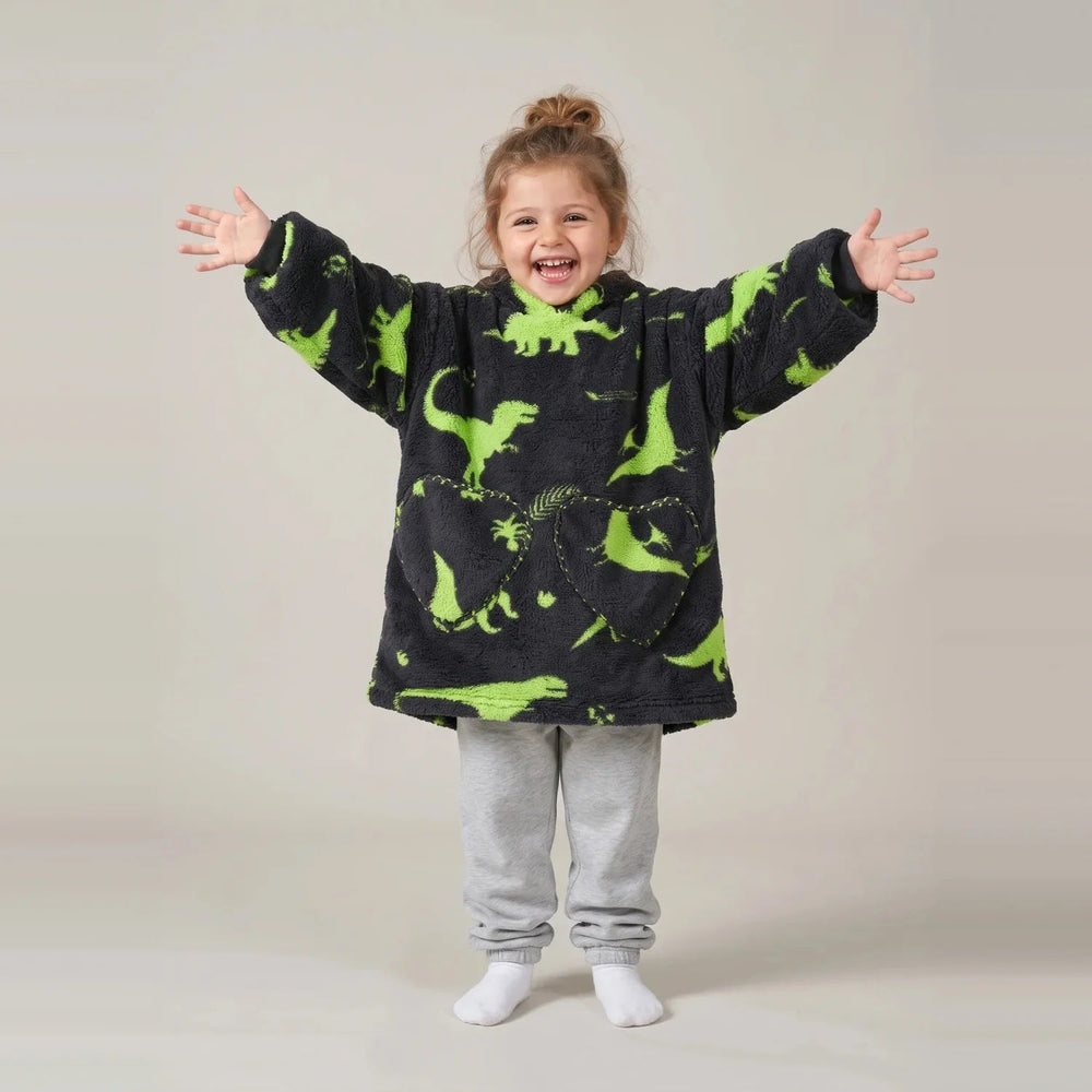 Toddler wearing the Green Dinos Toddler blanket hoodie, studio photo