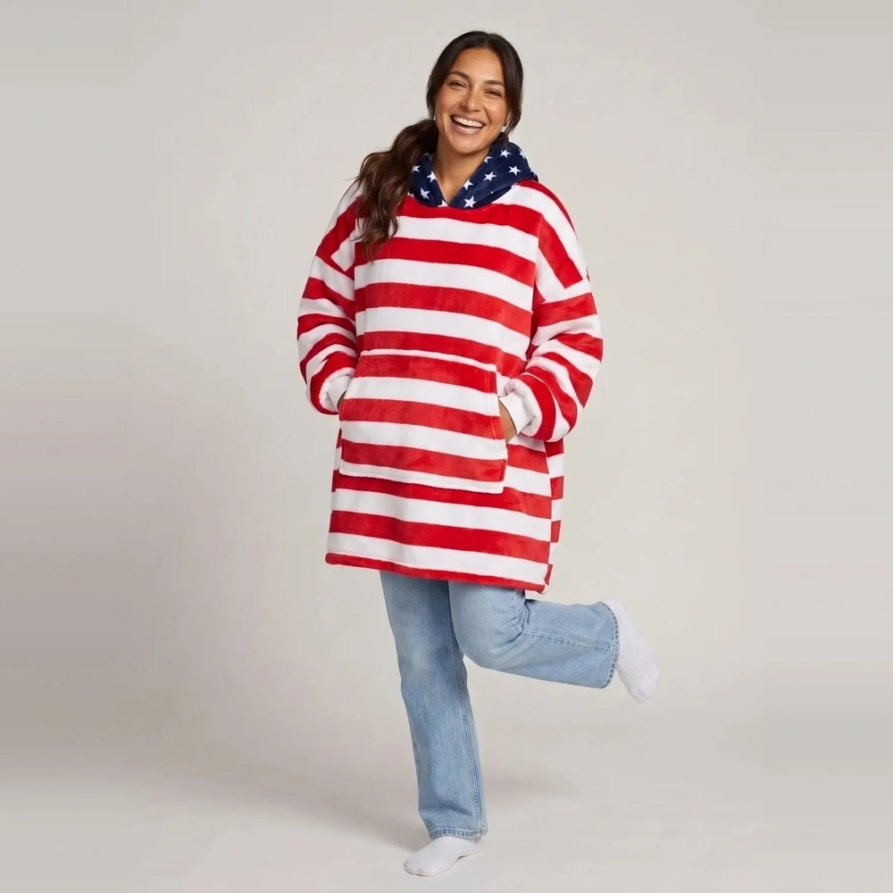 Model wearing the American Flag blanket hoodie, oversized unisex fit, studio photo
