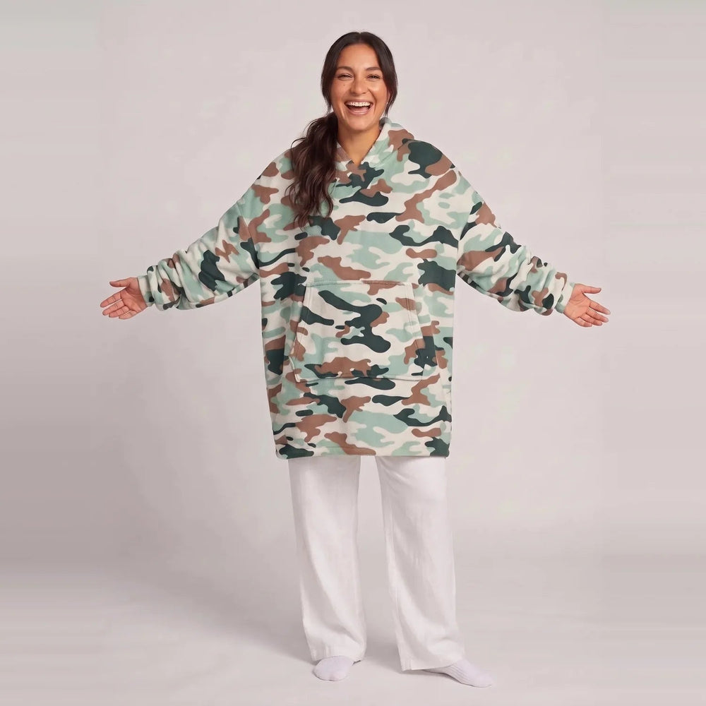 Model wearing the Camouflage blanket hoodie, oversized unisex fit, studio photo