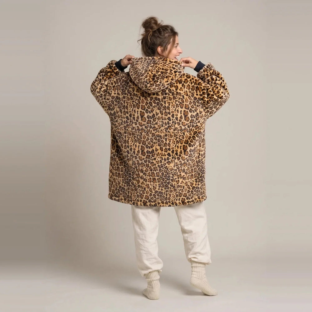 Back view of the Golden Leopard blanket hoodie showing the hood and oversized fit