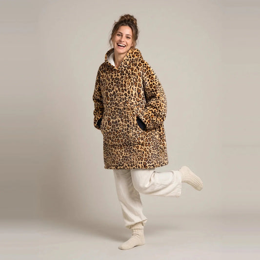 Model wearing the Golden Leopard blanket hoodie, oversized unisex fit, studio photo