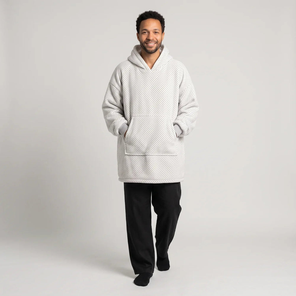 Man wearing the Gray Stripes blanket hoodie, unisex fit, studio photo