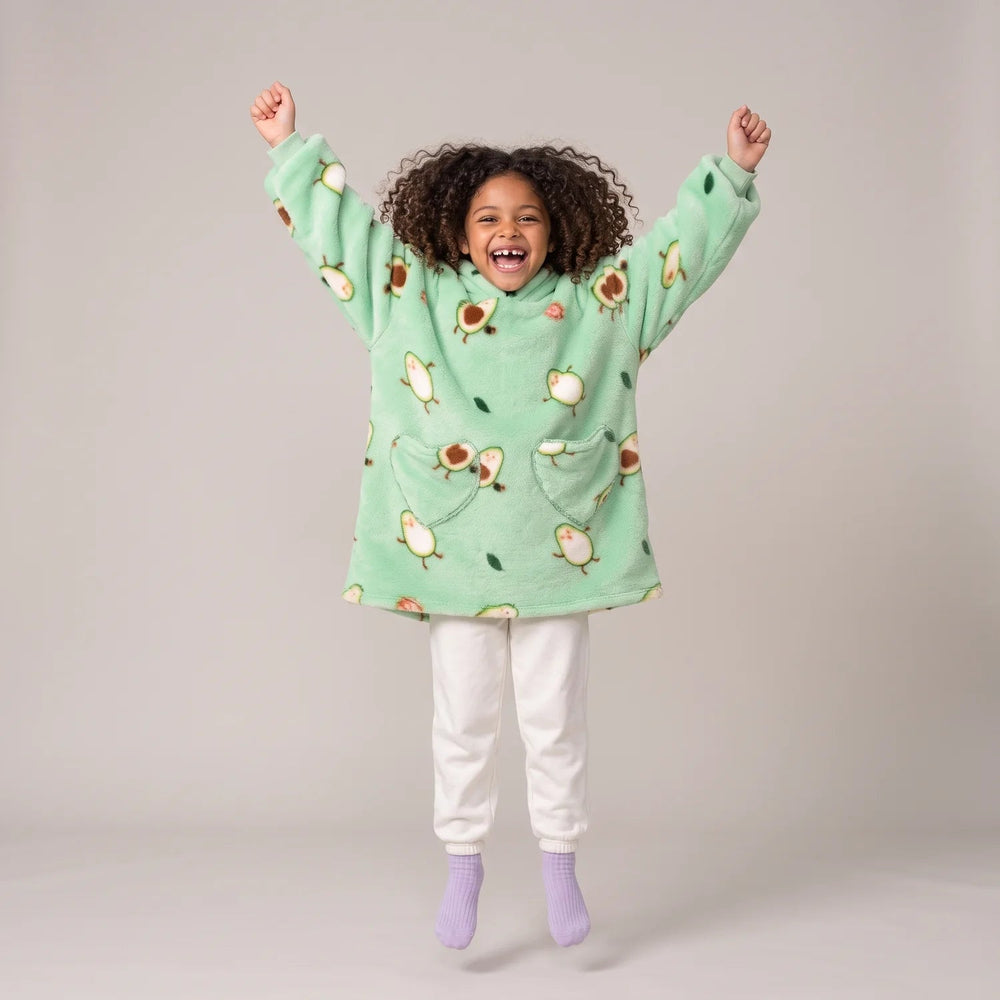 Child wearing the Avocado Kids blanket hoodie, studio photo