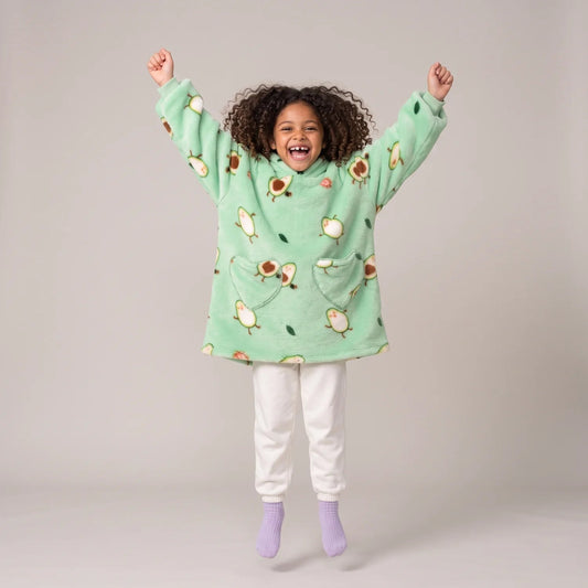 Child wearing the Avocado Kids blanket hoodie, studio photo