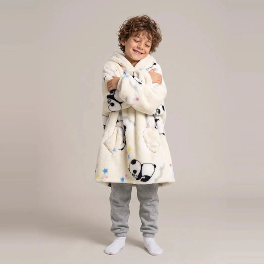 Child wearing the Cream Pandas Kids blanket hoodie, studio photo