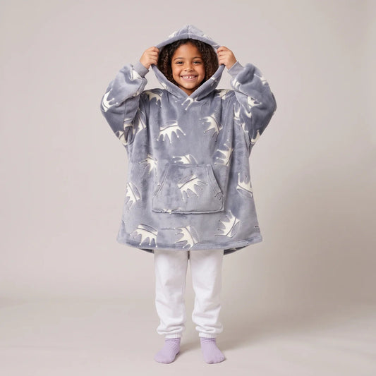 Child wearing the Gray Crowns Kids blanket hoodie, studio photo