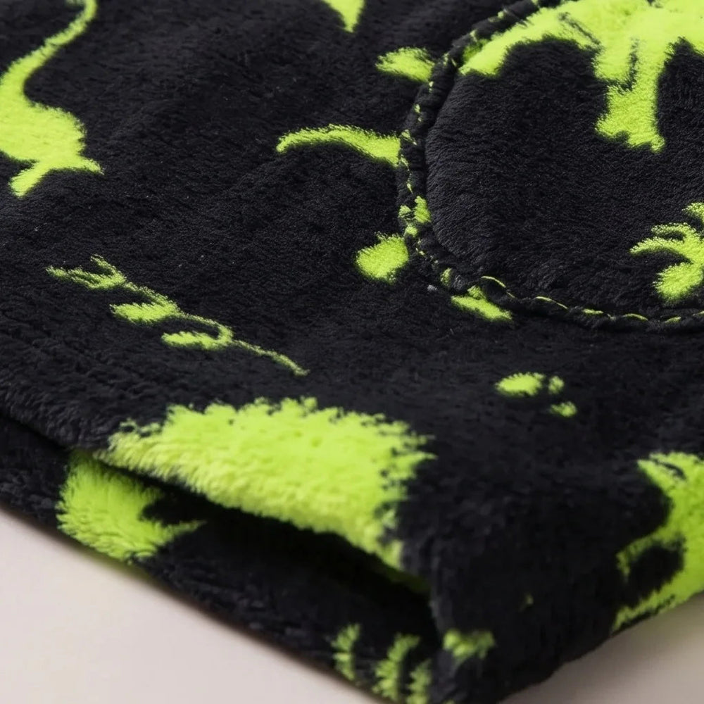 Close-up of the soft Green Dinos flannel and sherpa lining