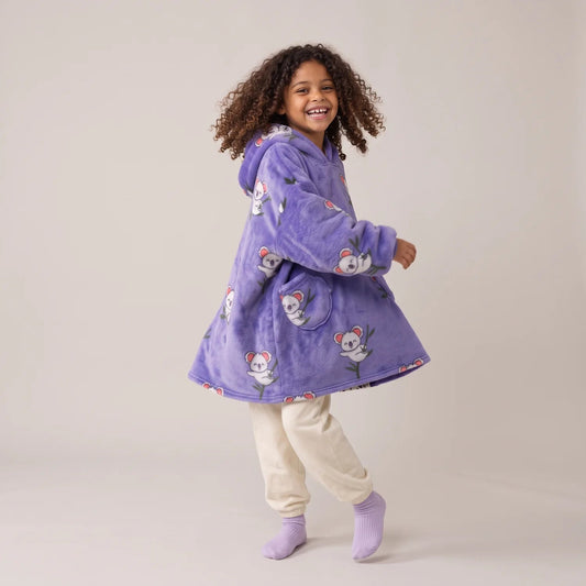 Child wearing the Koalas Kids blanket hoodie, studio photo