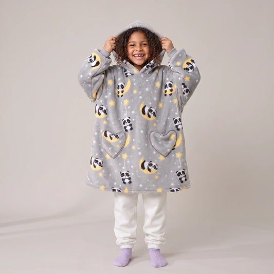 Child wearing the Moon Pandas Kids blanket hoodie, studio photo