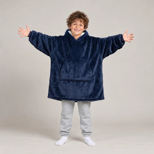 Child wearing the Navy Blue Kids blanket hoodie, studio photo