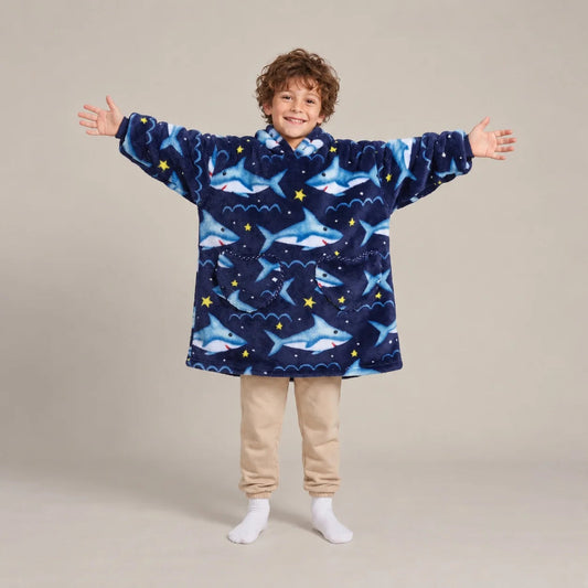 Child wearing the Navy Sharks Kids blanket hoodie, studio photo