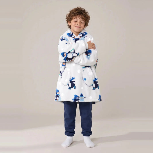 Child wearing the Penguins Kids blanket hoodie, studio photo