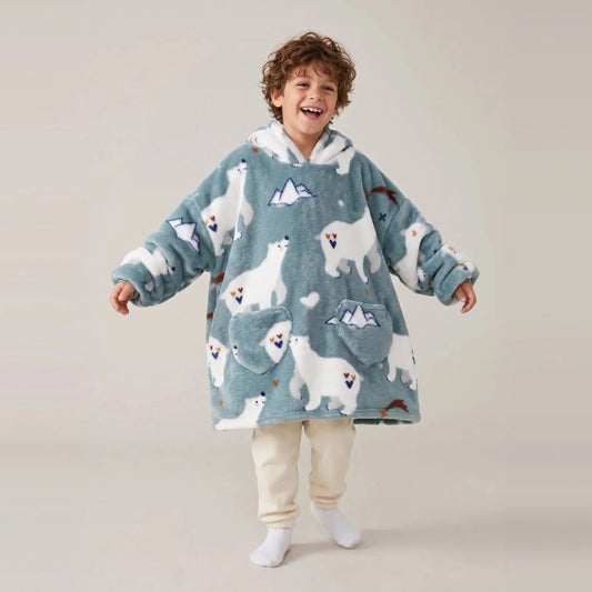 Child wearing the Polar Bears Kids blanket hoodie, studio photo