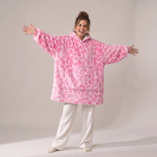 Model wearing the Pink Leopard blanket hoodie, oversized unisex fit, studio photo