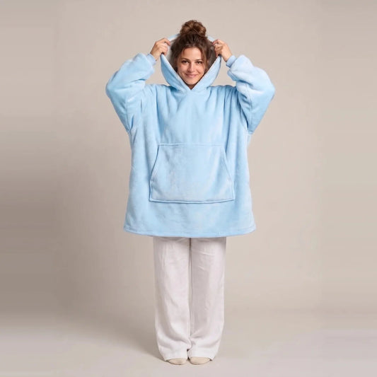 Model wearing the Sky Blue blanket hoodie, oversized unisex fit, studio photo
