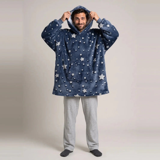 Model wearing the Stars blanket hoodie, oversized unisex fit, studio photo
