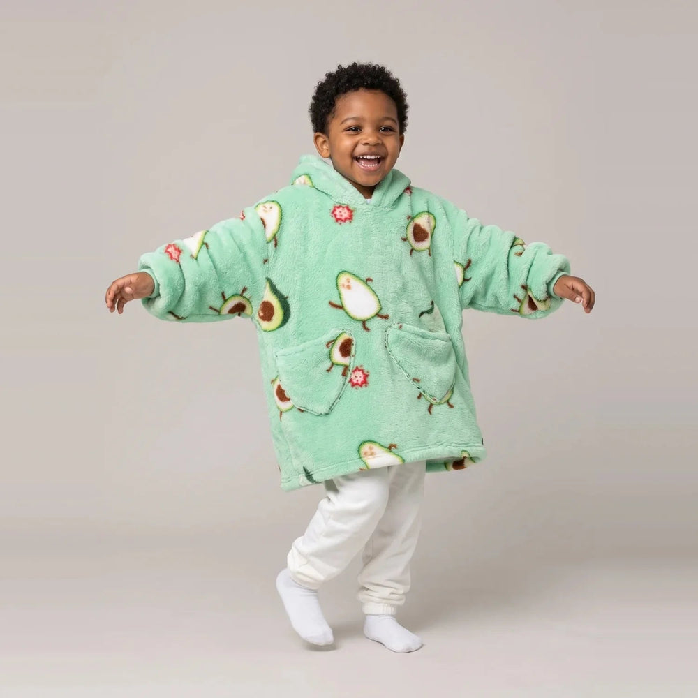 Toddler wearing the Avocado Toddler blanket hoodie, studio photo