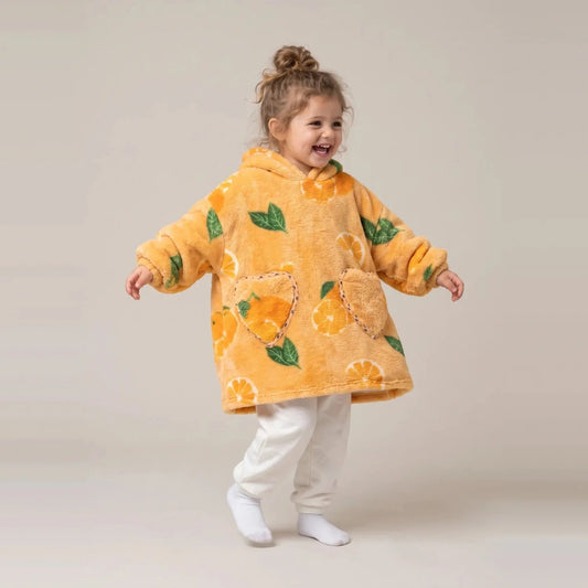 Toddler wearing the Oranges Toddler blanket hoodie, studio photo