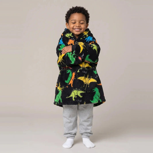 Toddler wearing the Rainbow Dinos Toddler blanket hoodie, studio photo